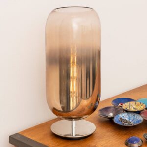 Lampe à poser Artemide Gople en verre bronze et argenté, allumée