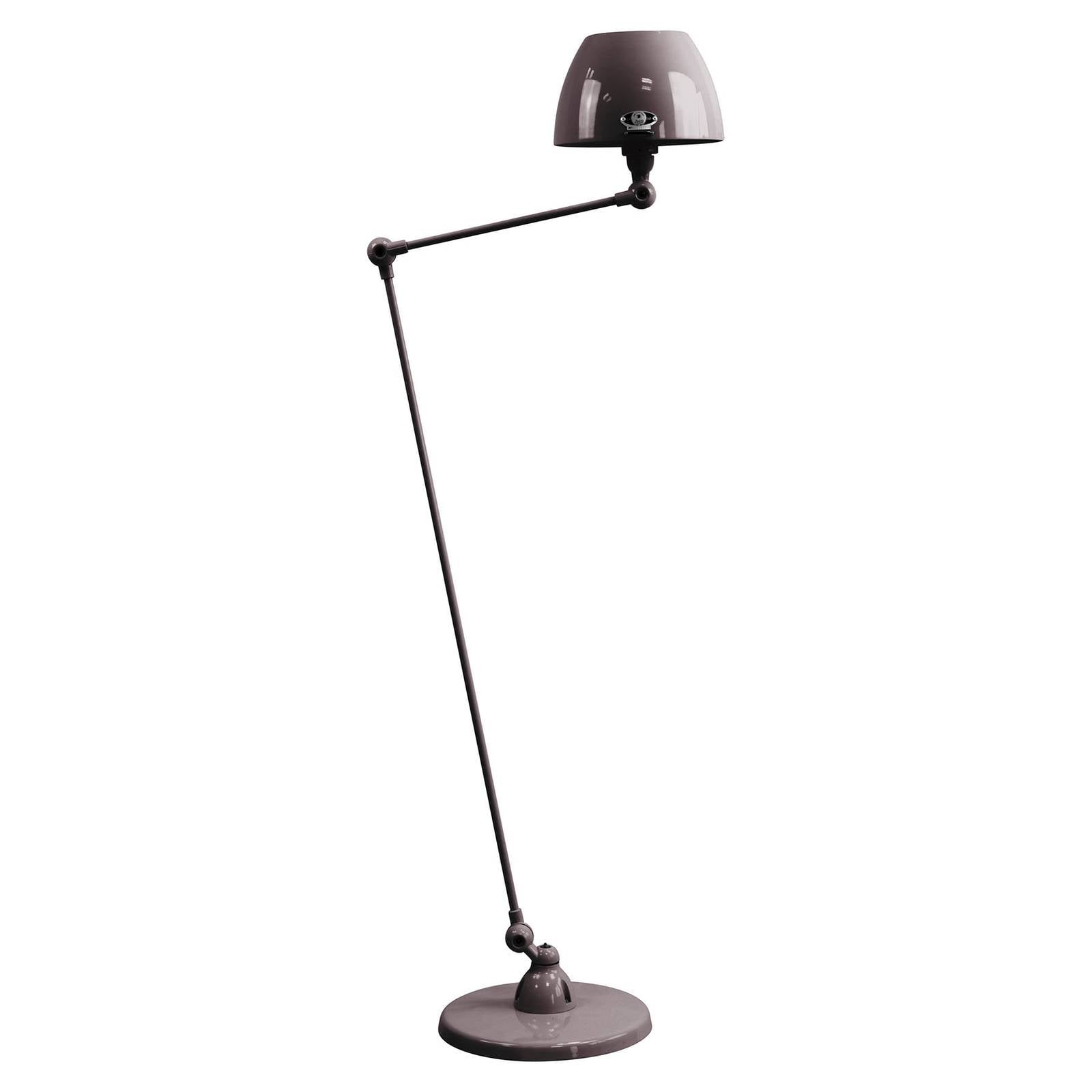 Lampadaire Jieldé Aicler AIC833 noir à bras articulé près d’un fauteuil
